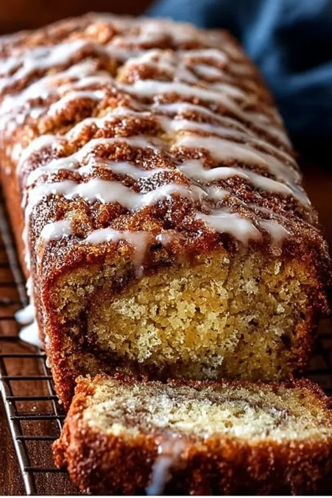 Delicious slice of cinnamon swirl banana bread on a wooden table
