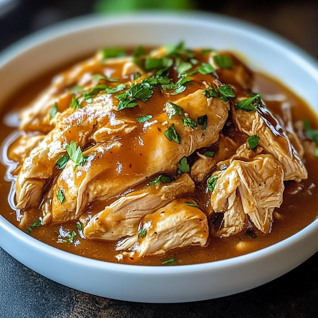 Mississippi-style Crockpot Chicken served in a bowl with colorful vegetables